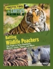 Battling Wildlife Poachers : The Fight to Save Elephants, Rhinos, Lions, Tigers, and More - Book
