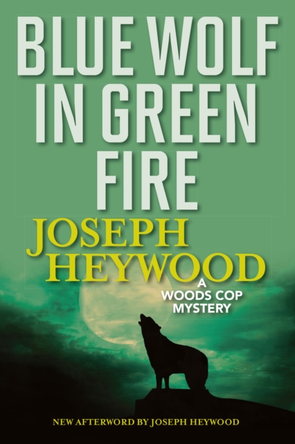 Blue Wolf In Green Fire : A Woods Cop Mystery, Paperback / softback Book