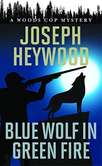 Blue Wolf in Green Fire : A Woods Cop Mystery, Paperback / softback Book
